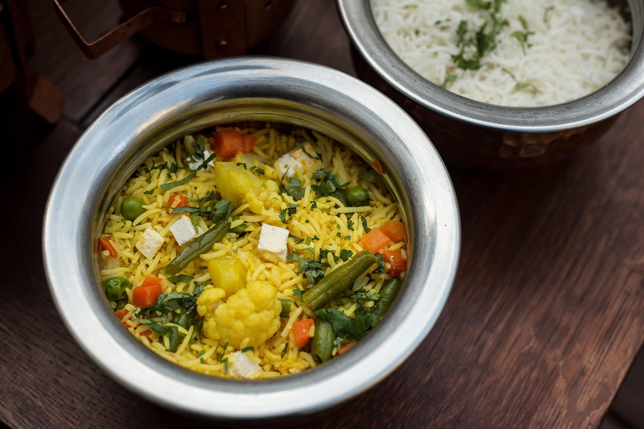 A steaming pot of one-pot rice dinner on the stove