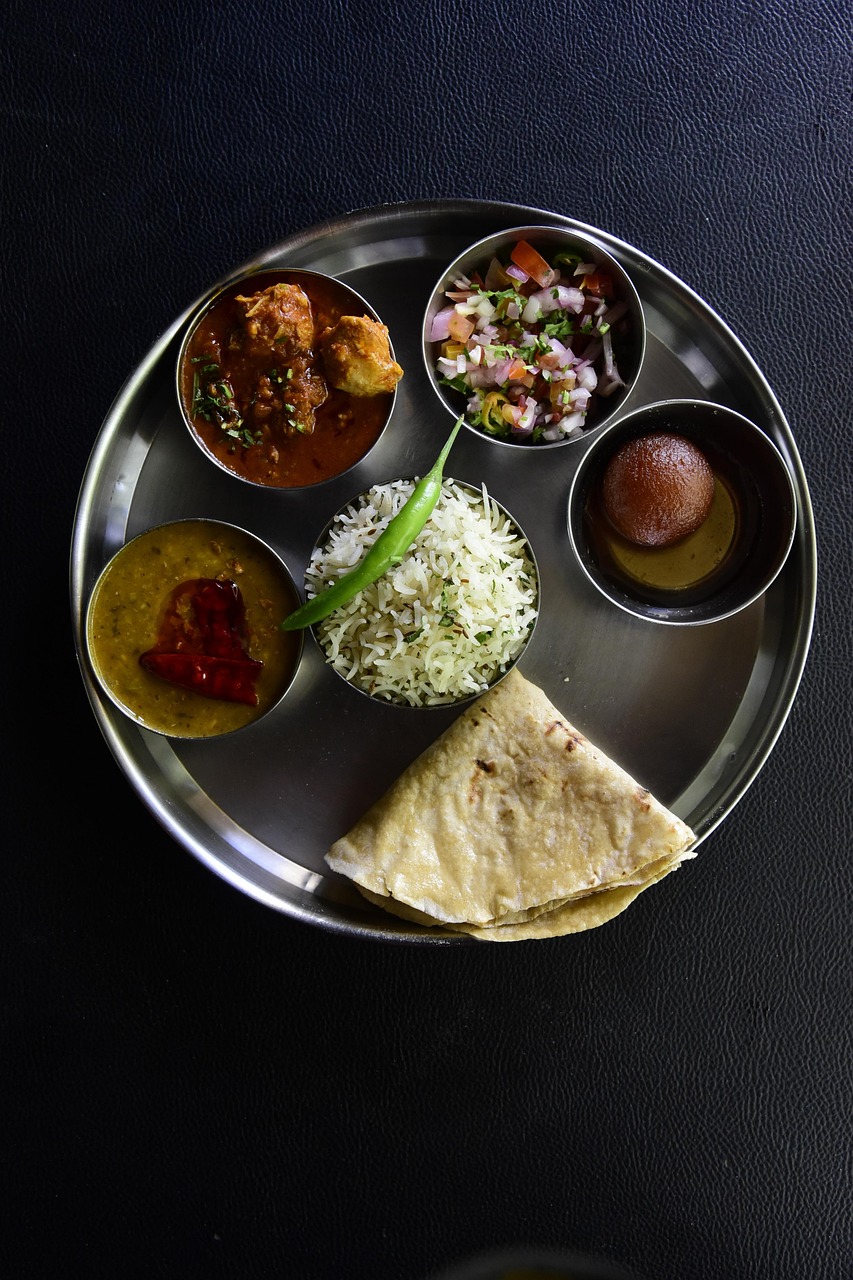 A traditional Indian thali with dal, sabzi, roti, rice and accompaniments