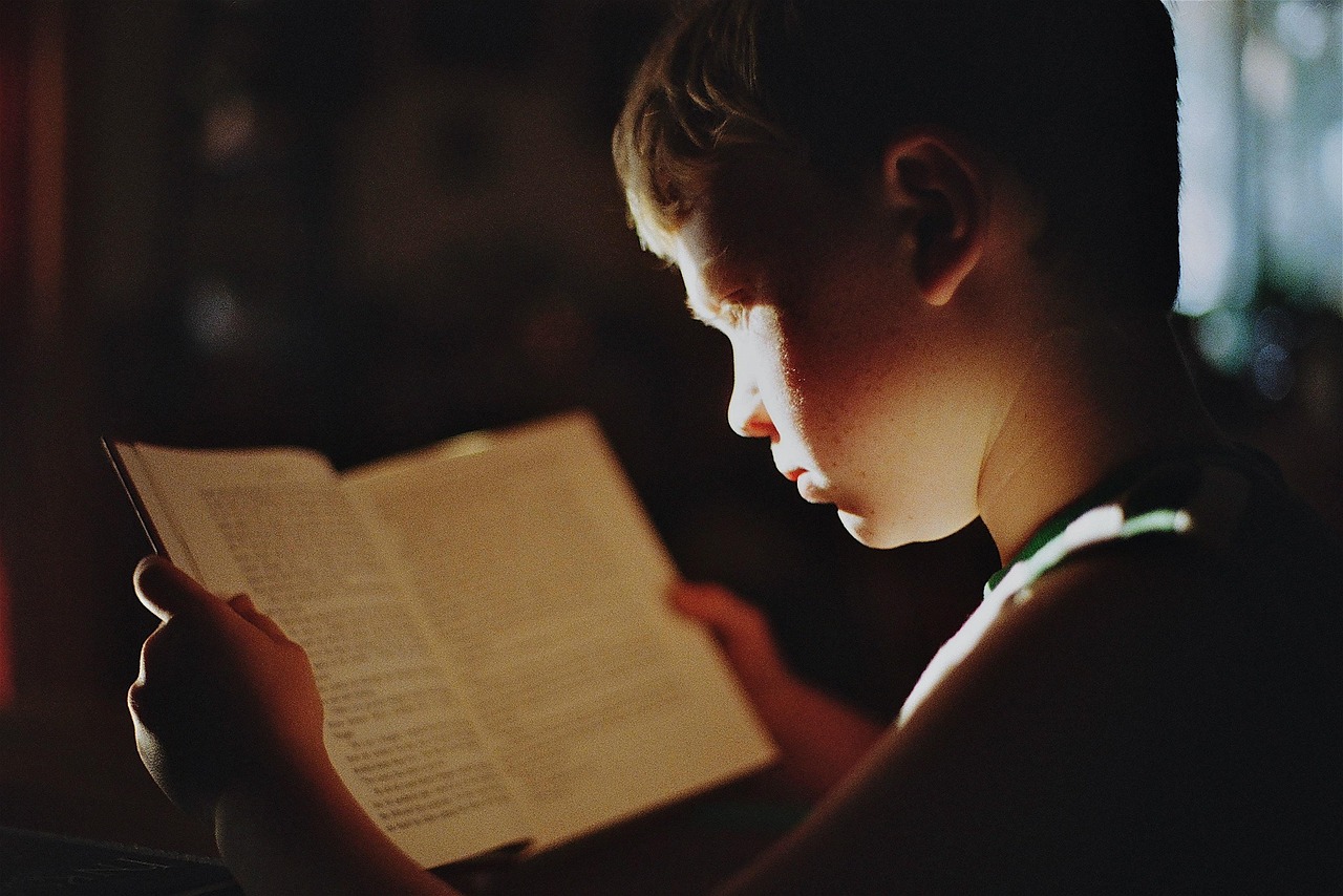 A tidy study desk with lamp and books in a child's corner
